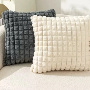 Luxurious checkerboard faux rabbit fur pillow covers in cream and charcoal grey