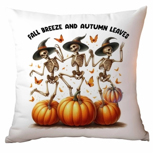 Detailed close-up of pumpkin Halloween cushion cover with festive dancing skeletons print