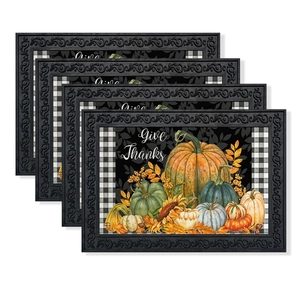 Close-up of Thanksgiving placemats with pumpkins, buffalo check and Give Thanks text