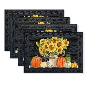 Detailed macro view of four autumn-themed placemats with sunflowers and pumpkins