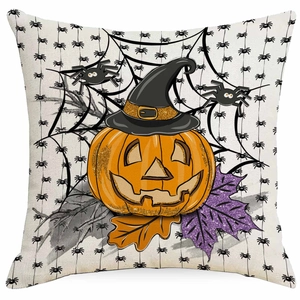 Detail of Halloween pillow cover featuring a witch hat pumpkin and glitter leaves