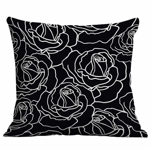 Dettaglio della fodera per cuscino floreale con rose line art bianche su fondo nero