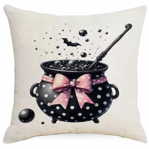 Detail of Halloween pillow case with witch cauldron, black bats and pink bow decoration
