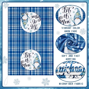 Detail of blue gnome microfiber towel showing soft texture and Let it Snow print