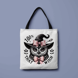 Close-up of Halloween witch owl print and fabric texture on a beige canvas tote bag