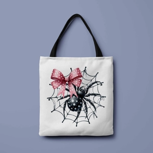 Close-up of Halloween tote bag showing detailed spider and web print on white canvas