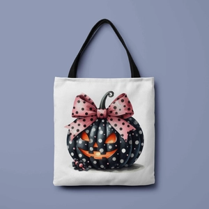 Close-up of Halloween tote bag with black pumpkin and pink polka dot bow design