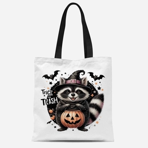 White Halloween canvas tote bag with raccoon witch print and Trick or Trash slogan