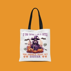 Detail showing mini Halloween canvas tote bag with witch and pumpkin illustration