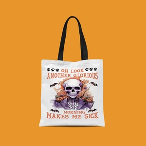 Detailed close-up of Halloween canvas tote bag with skeleton and pumpkin graphics
