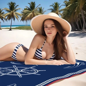 Detail showing high-density microfiber fabric with nautical helm print on beach towel