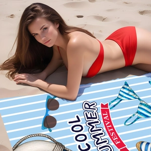 Detail of microfiber beach towel showing striped pattern and cool summer festival text