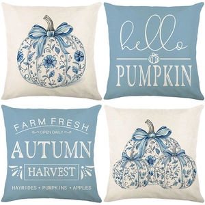 Detailed close-up of autumn pumpkin pillow covers showing natural linen fabric texture