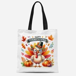 Détail du sac en toile blanc avec illustration festive de dinde et de citrouille
