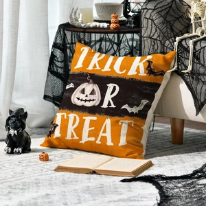 Halloween Trick or Treat linen pillow cover with pumpkins and bats in festive room decor