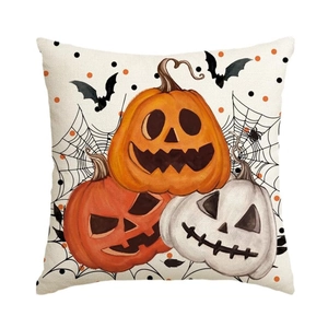 Detail of linen texture showing spooky Halloween pumpkins, bats and cobwebs on pillowcase