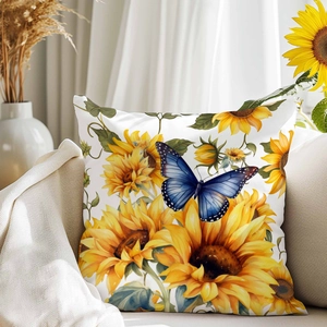 Luxuriöser Kissenbezug mit Sonnenblumen und blauem Schmetterling auf dem Sofa