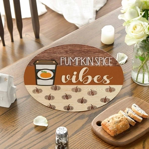 Macro view of linen placemat featuring Pumpkin Spice vibes text and coffee design