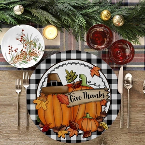 Macro shot of Give Thanks linen placemat with pumpkins and buffalo check border