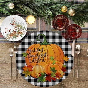 Linen placemat with pumpkin and maple leaf design for Thanksgiving table decor