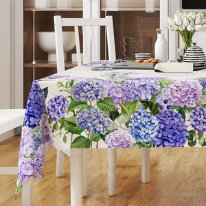 Detail of sunflower and hydrangea print fabric showing textile texture on rectangular tablecloth