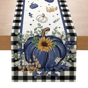 Detailed weave of autumn table runner with blue pumpkin, sunflower and plaid borders