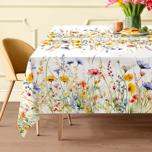 Detailed view of tablecloth with colorful wildflower print and natural linen texture
