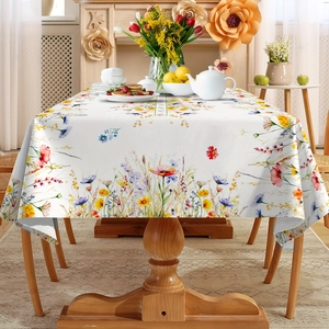 Close-up of rectangle white tablecloth with colorful watercolor wildflower patterns