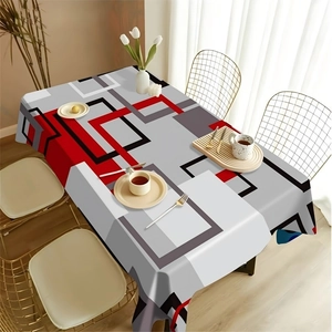 Close-up of modern geometric rectangle tablecloth with artistic red and grey pattern