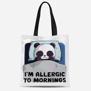 Close-up of cute sleeping panda print on white canvas tote bag with black handle straps