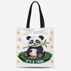 Detailed close-up of cute panda canvas tote bag featuring Don't Grow Up It's A Trap print