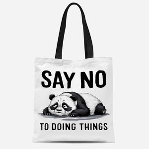 White canvas tote bag with black handles featuring a lazy panda and a slogan print