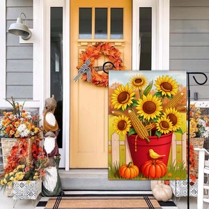Close-up of autumn garden flag featuring pumpkins, sunflowers, and vibrant fall harvest details