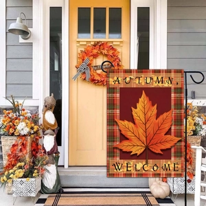 Autumn Welcome garden flag with maple leaf and plaid border on porch display