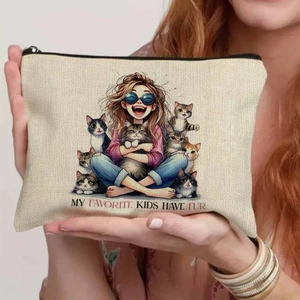 Detail showing the canvas fabric texture and cat lover print on a travel makeup bag