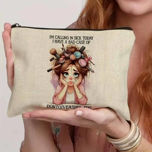 Close-up of canvas makeup bag featuring colorful cartoon illustration and metal zipper
