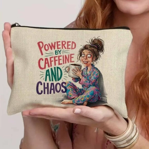 Detail of canvas makeup bag featuring caffeine and chaos quote and humorous illustration