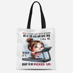 Close-up of white canvas tote bag featuring a funny fitness cartoon and quote