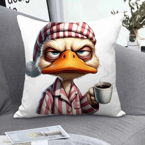 Detail of cartoon tired duck pillow case on grey sofa with magazine and green plant