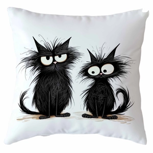 Detailed close-up of a white decorative pillow cover with quirky black cat illustrations