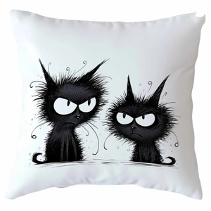 Detail shot of square white throw pillow featuring two grumpy black cartoon cats