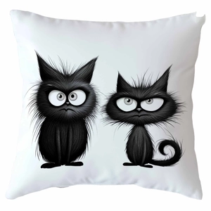 Close-up of decorative pillowcase with cartoon black cats print on white canvas fabric