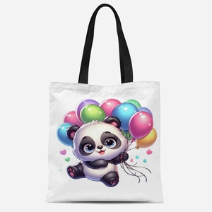 Detailed view of white canvas tote bag featuring cute cartoon panda holding colorful balloons