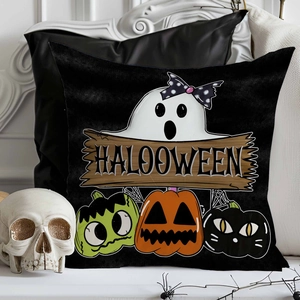 Detail of Halloween ghost and pumpkin pillowcase with skull and spider decor