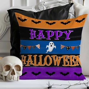 Macro detail of Happy Halloween throw pillow case with ghost and bat prints on striped fabric