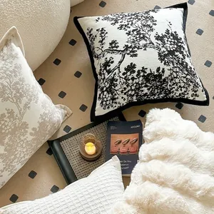 Luxury chenille pillow cover featuring black and white tree patterns and modern art texture