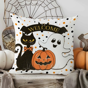 Detail of Halloween pillow case featuring ghost, black cat, and welcome banner decor