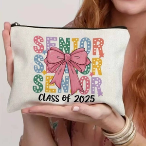 Detailed shot of canvas makeup bag with Senior Class of 2025 bow print design