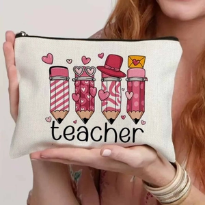 Canvas teacher makeup bag with pink cartoon pencil prints and a sturdy black zipper