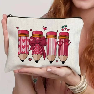 Detailed macro view showing canvas texture and floral pencil prints on teacher makeup bag